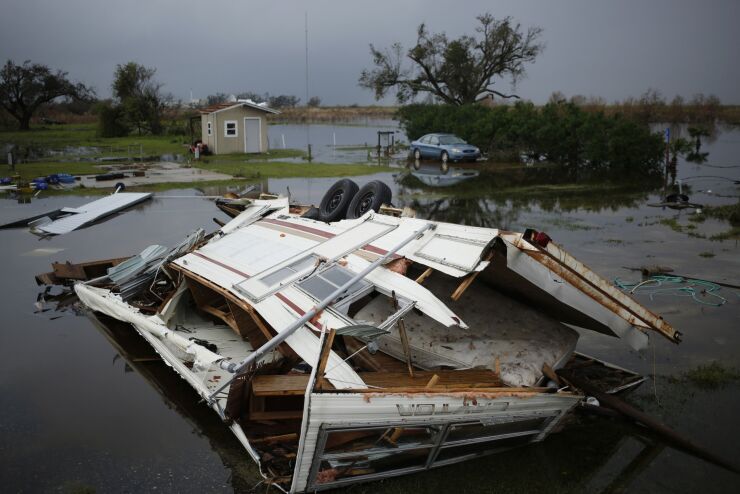 A recreational vehicle destroyed after Hurricane Laura made landfall in Holly Beach, Louisiana, U.S., on Friday, Aug. 28, 2020. Hurricane Laura, one of the most powerful storms ever to hit Louisiana, left a path of chemical fires, wrecked buildings, flooded roads and what could be more than $15 billion in insured losses, with reports of at least six people dead. Photographer: Luke Sharrett/Bloomberg