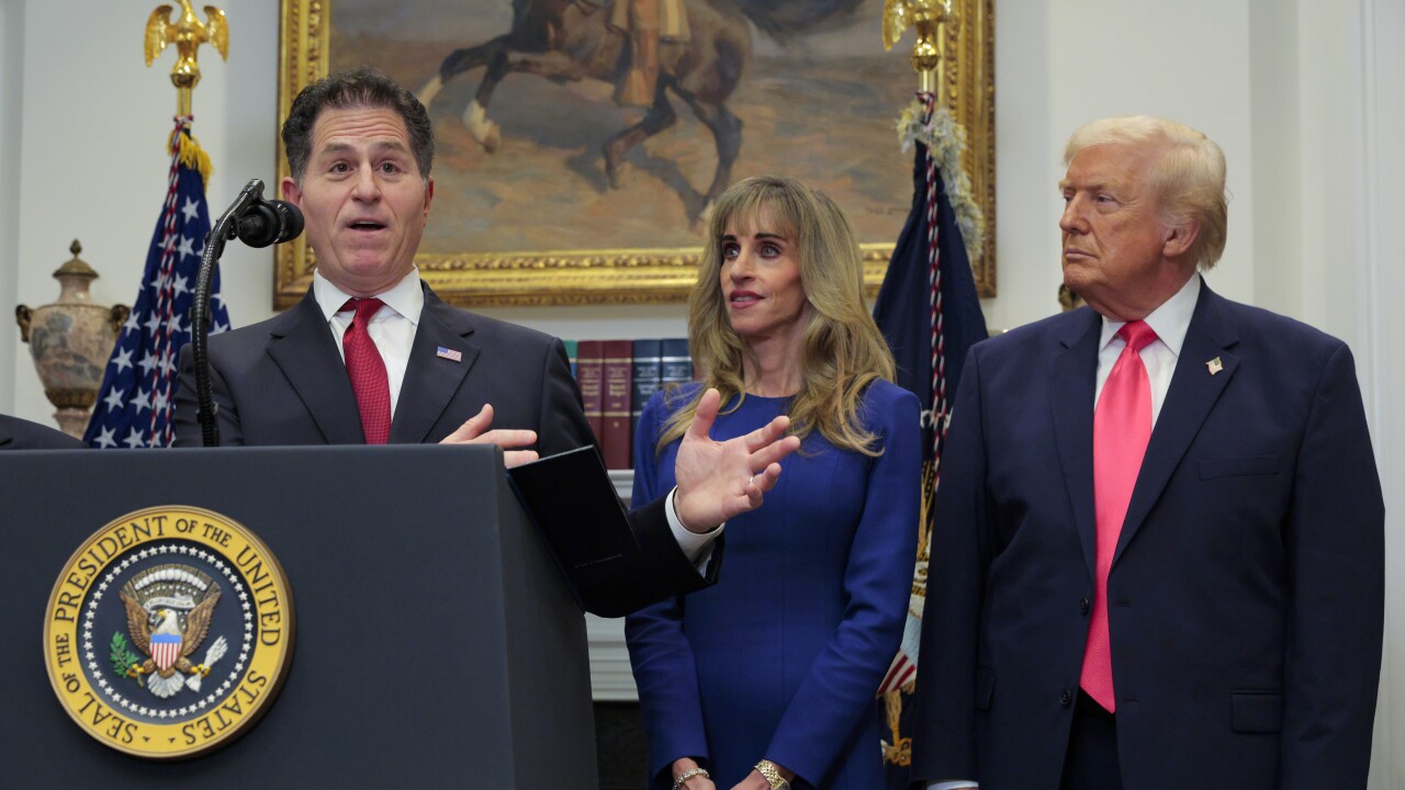 (L-R) Tech billionaire Michael Dell speaks as his wife Susan Dell and President Donald Trump look on while making an announcement about "Trump accounts" in the Roosevelt Room at the White House.
