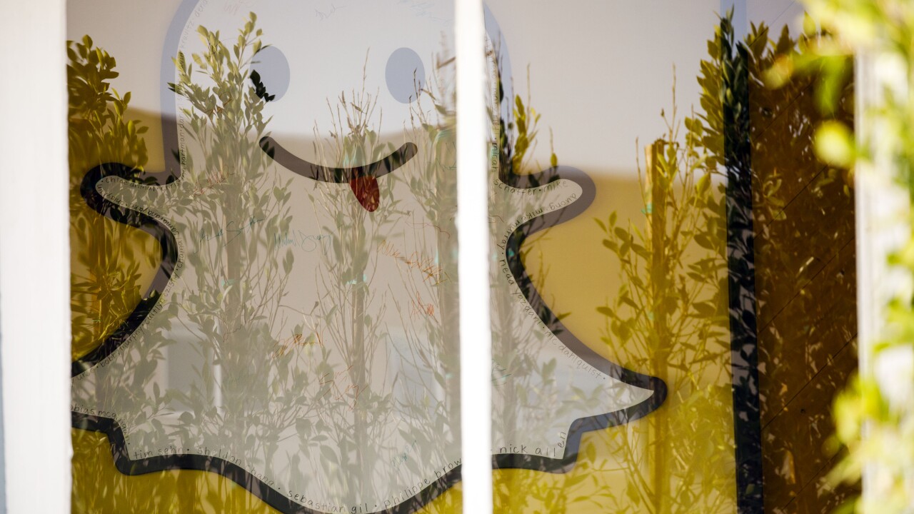 Snap Inc. logo behind a window