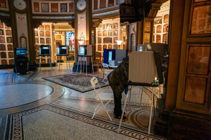 A voter casts a ballot inside the San Francisco Columbarium polling station on March 5, 2024.