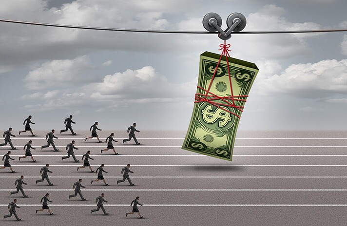 Image showing people on a track chasing after a stack of money pulled along in front of them.