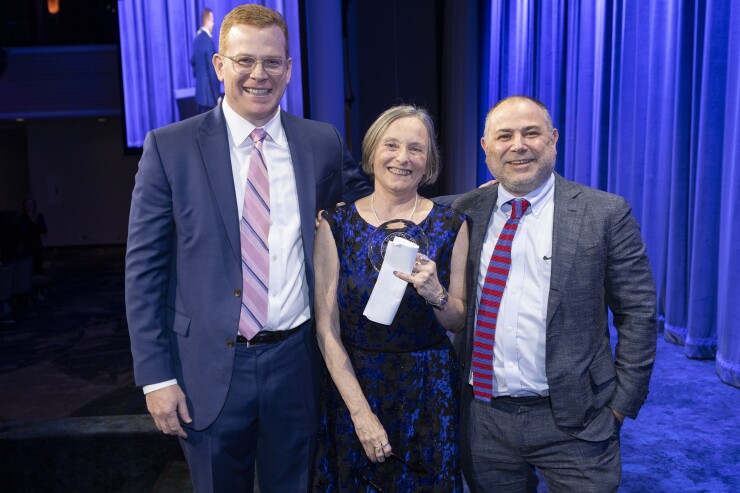 Marjorie Henning, Michael Britchkow and Ray Orlando onstage at the municipal forum of new york's annual dinner