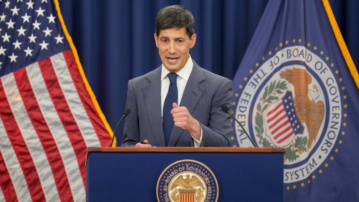 Fed Chair Kevin Warsh behind a podium