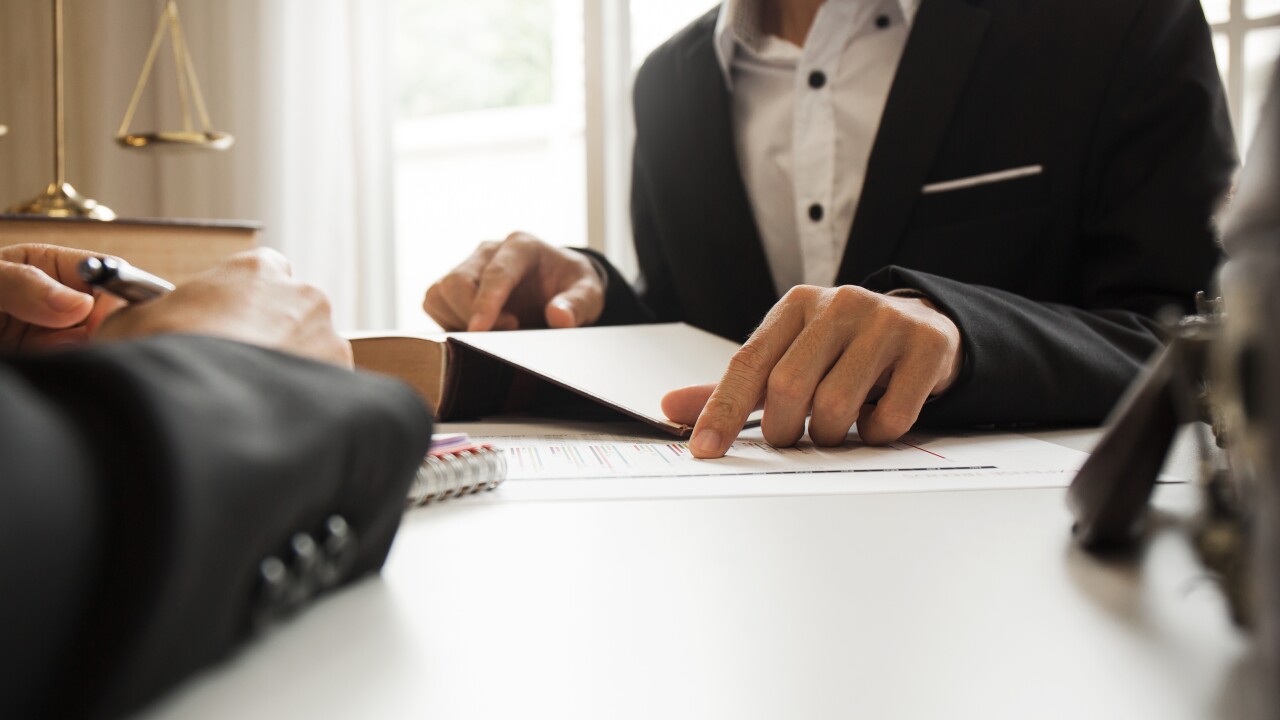 The hard work of an asian lawyer in a lawyer's office. Counselin