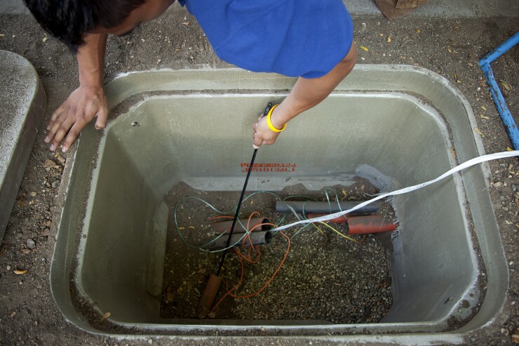 The head of a fiber optic cable is pulled from an underground tube on Wednesday, September 11, 2013 in Minneapolis, MN in a gigabit fiber installation by the firm US Internet.