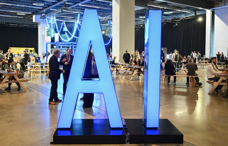 An illuminated AI sign in an exhibit hall at All In in Montreal in September 2023