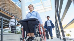 Disabilities - female wheelchair user on ramp