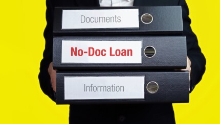No-Doc Loan. Businessman is carrying a stack of 3 file folders.