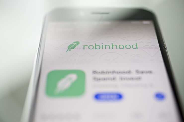 The Robinhood application is displayed in the App Store on an Apple Inc. iPhone in an arranged photograph taken in Washington, D.C., U.S., on Friday, Dec. 14, 2018. The Securities Investor Protection Corp. said a new checking account from Robinhood Financial LLC raises red flags and that the deposited funds may not be eligible for protection. Photographer: Andrew Harrer/Bloomberg