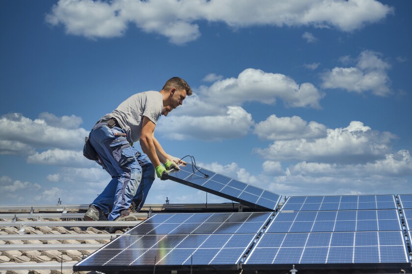 Rooftop solar panels being installed