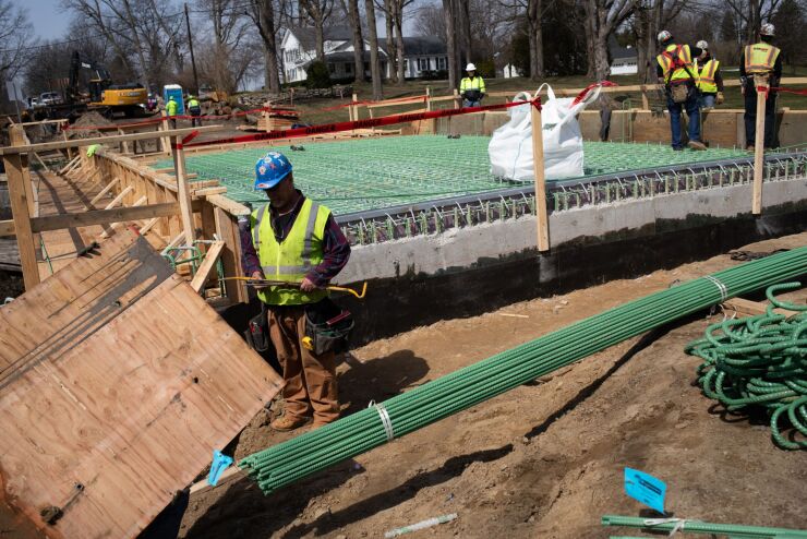 Contractors work at a Michigan Department of Transportation bridge construction site in 2022.