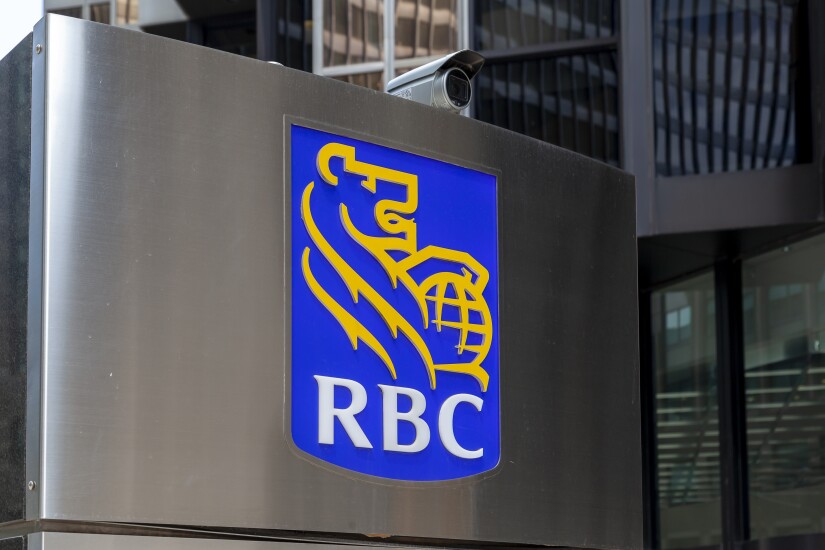 Toronto, Canada - May 16, 2020: RBC sign in Toronto’s financial district Toronto, Ontario. RBC (Royal Bank of Canada) is a Canadian multinational financial services company.