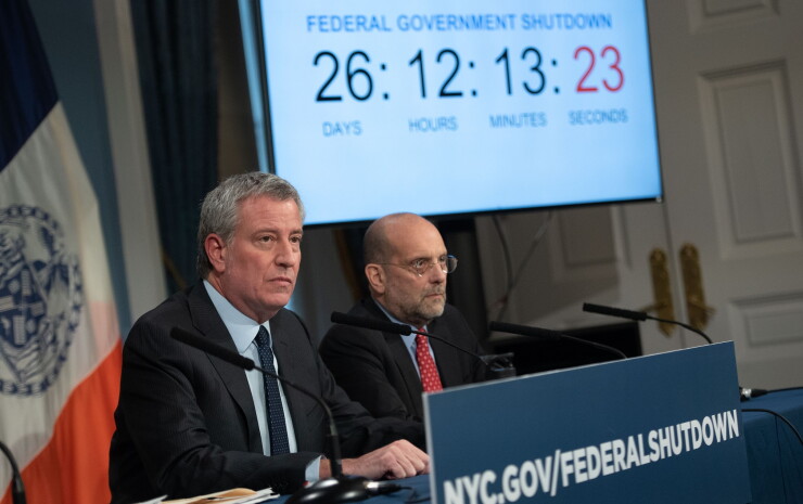 New York Mayor Bill de Blasio, left, talking about the federal government shutdown on Jan. 17, 2019.
