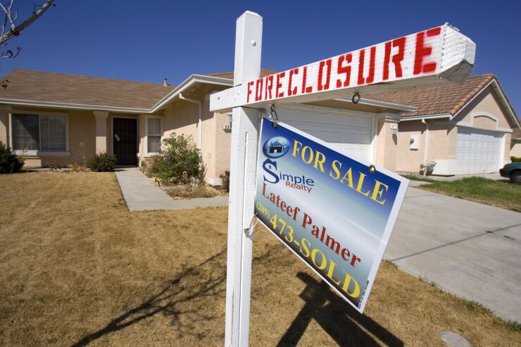 A foreclosure sign is posted outside a house in Stockton, California, U.S., on Thursday, Sept. 18, 2008.
