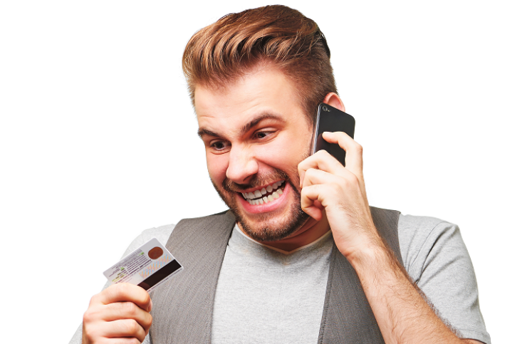 Stock image of a man angry on the phone with ATM card in hand