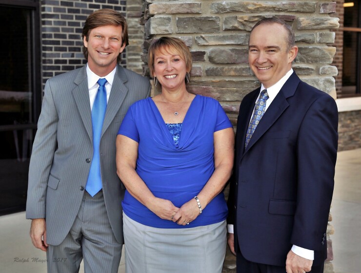 From left to right: Ameriprise advisor Heath Bartlett, client associates Andrea Hallas and Fred Johnson