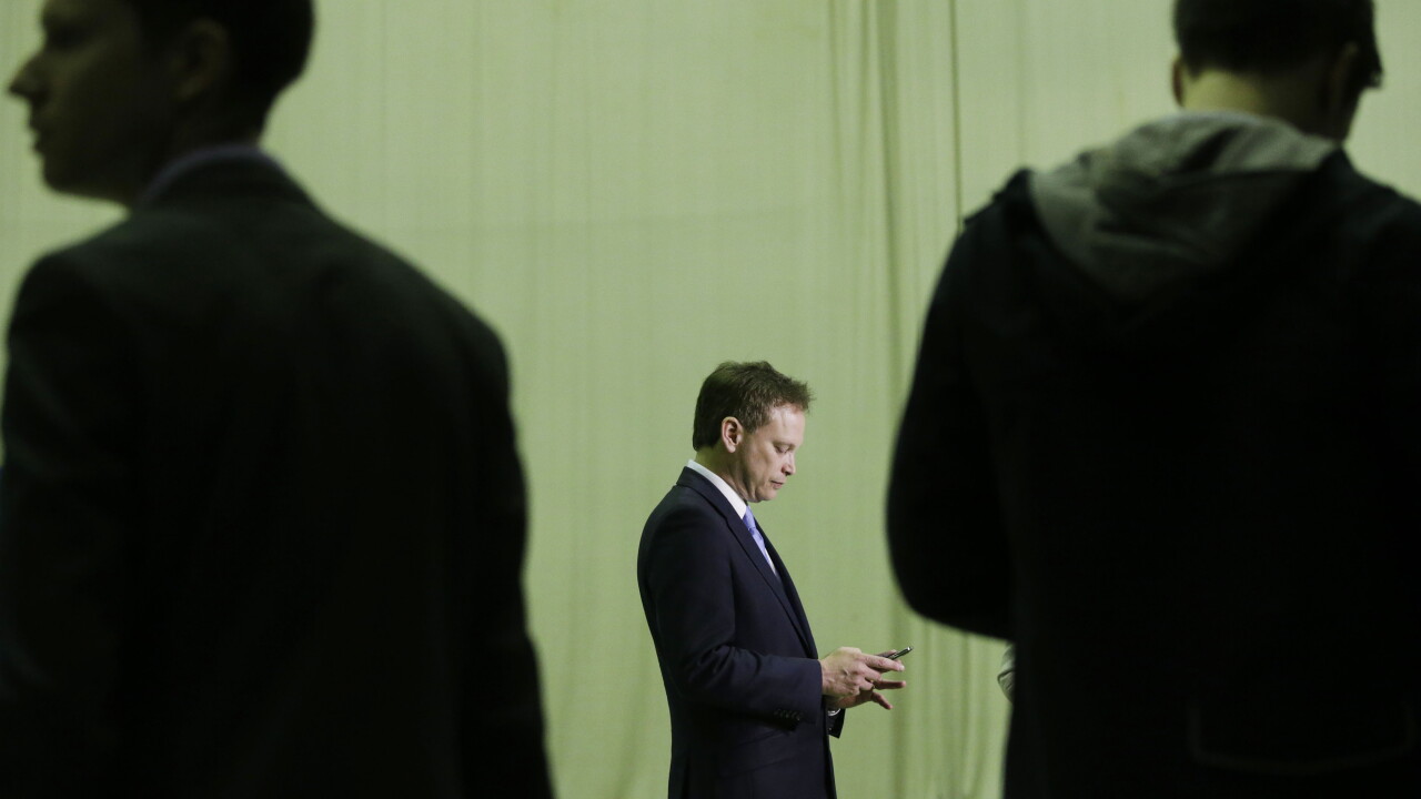 businessmen on cel phone texting