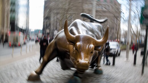 The famous bull sculpture stands near Wall Street in New York, U.S., on Friday, Feb. 12, 2016. U.S. stocks halted a five-day slide that dragged global equities into a bear market, as oil rebounded from a 12-year low and bank shares surged. Photographer: Michael Nagle/Bloomberg