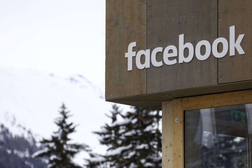 A logo sits on the side of the Facebook pop-up office ahead of the World Economic Forum in Davos, Switzerland, on Jan. 21, 2119.
