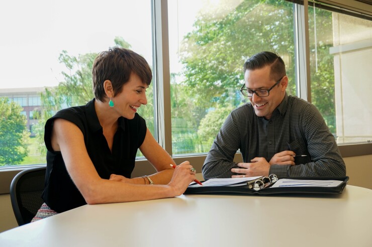 Karly Scholl, left, and Jason Anderson, of CommunityAmerica CU's College and Career Planning program