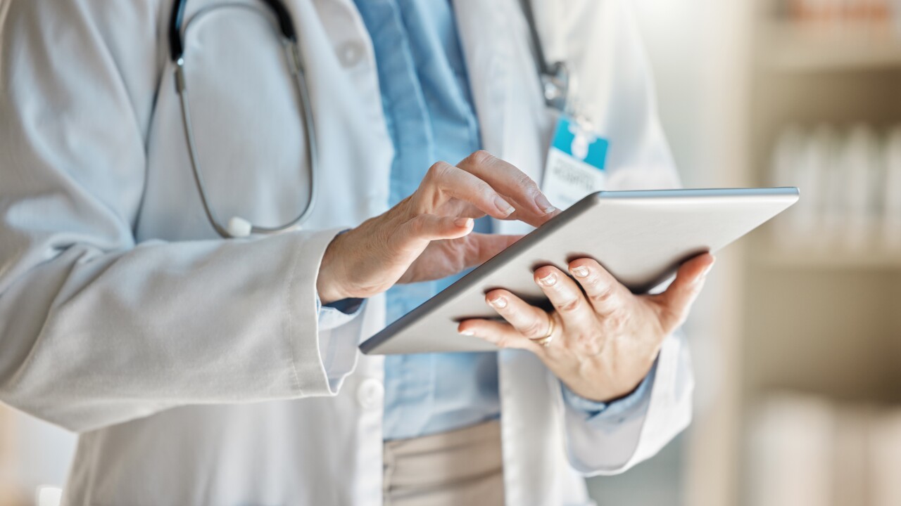 Doctor, office and tablet for research, email or communication. Medic, hospital and reading article, data or health magazine on web, while working with technology in healthcare center or clinic.