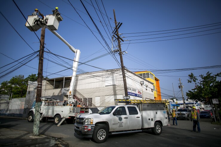 PREPA workers restoring electricity after Maria