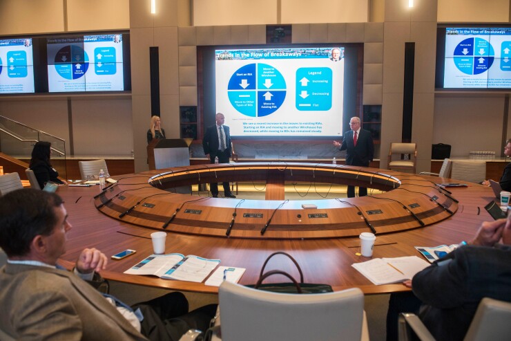 Deal Makers debate: from left, moderator Megan Carpenter, FiComm Partners; Dan Seivert, Echelon Partners; Mark Tibergien, chief executive officer of Pershing Advisor Solutions. Pershing Advisor Solutions.