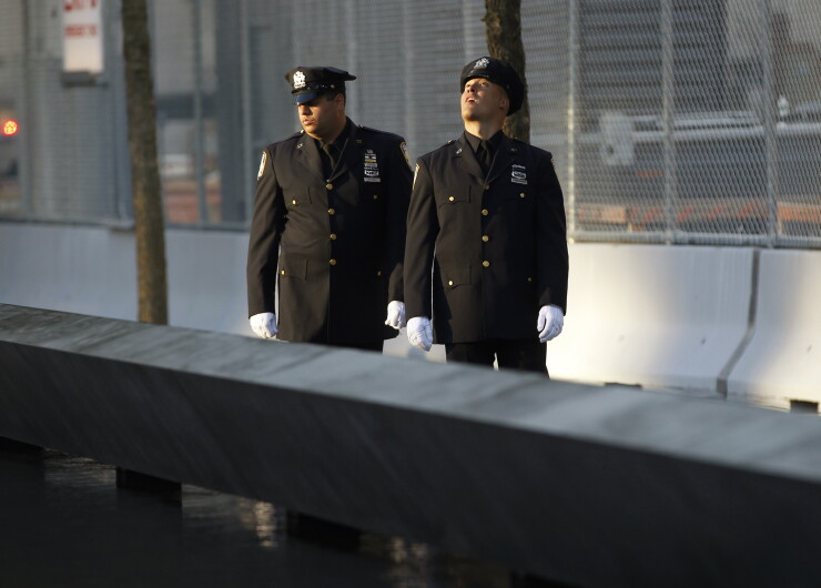 A picture of a two police officers at the Sept. 11 memorial.