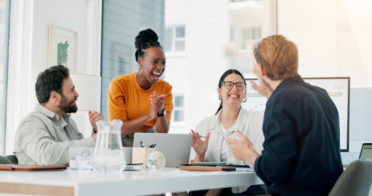 Smiling employees in a conference room