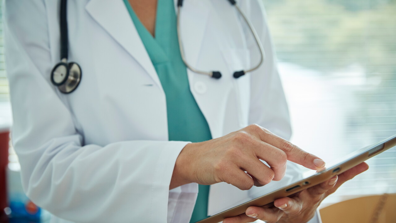 Doctor scrolling on an iPad