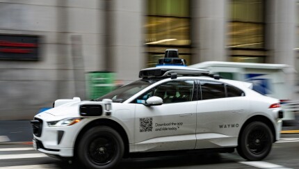 Waymo vehicle driving on San Francisco street