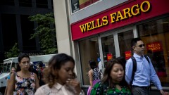 Wells Fargo people walking by Bloomberg News