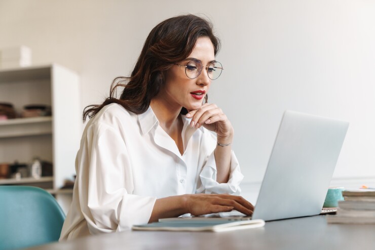 Woman sitting in front of her computer working