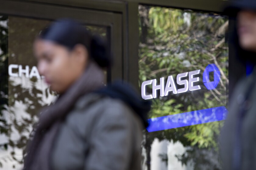 A pedestrian walks past a JPMorgan Chase bank branch in Chicago on Oct. 12, 2019.