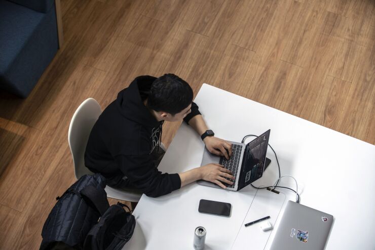 An employee works at XD Inc.'s Tap Tap office in Shanghai, China, on Thursday, Jan. 21, 2021. Shares in indie game distributor XD rose 24% on the first trading day of 2021 after Huawei Technologies Co. temporarily removed all Tencent Holdings Ltd. games from its app store in a dispute over their revenue split. Photographer: Qilai Shen/Bloomberg