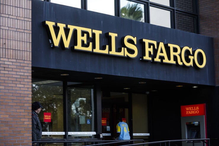 A customer enters a Wells Fargo bank branch in St. Petersburg, Florida, on Jan. 14, 2019.