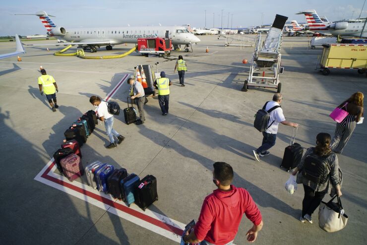 Passengers and a regional jet at Charlotte Douglas International Airport