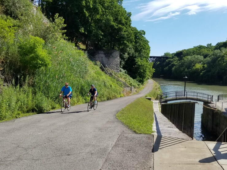 Bicyclists along the Erie Canal in Lockport, New York.