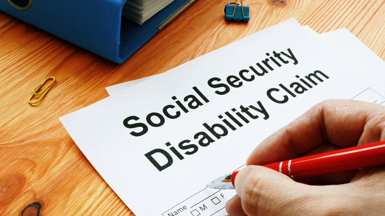 Man filling in Social Security Disability Claim.