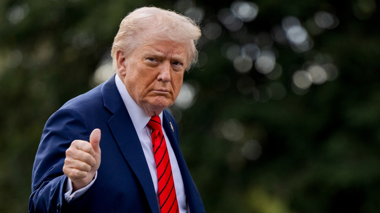 President Donald Trump walks on the South Lawn of the White House.