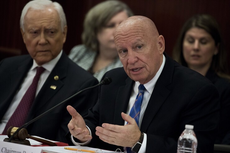 Brady, Rep. Kevin Brady, R-Texas, speaks as Sen. Orrin Hatch, R-Utah, listens