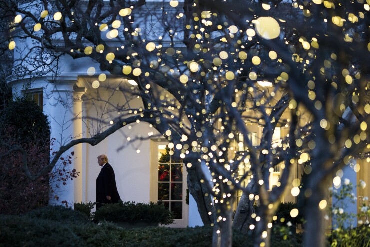 President Donald Trump walks out of the Oval Office before boarding Marine One on the South Lawn of the White House.