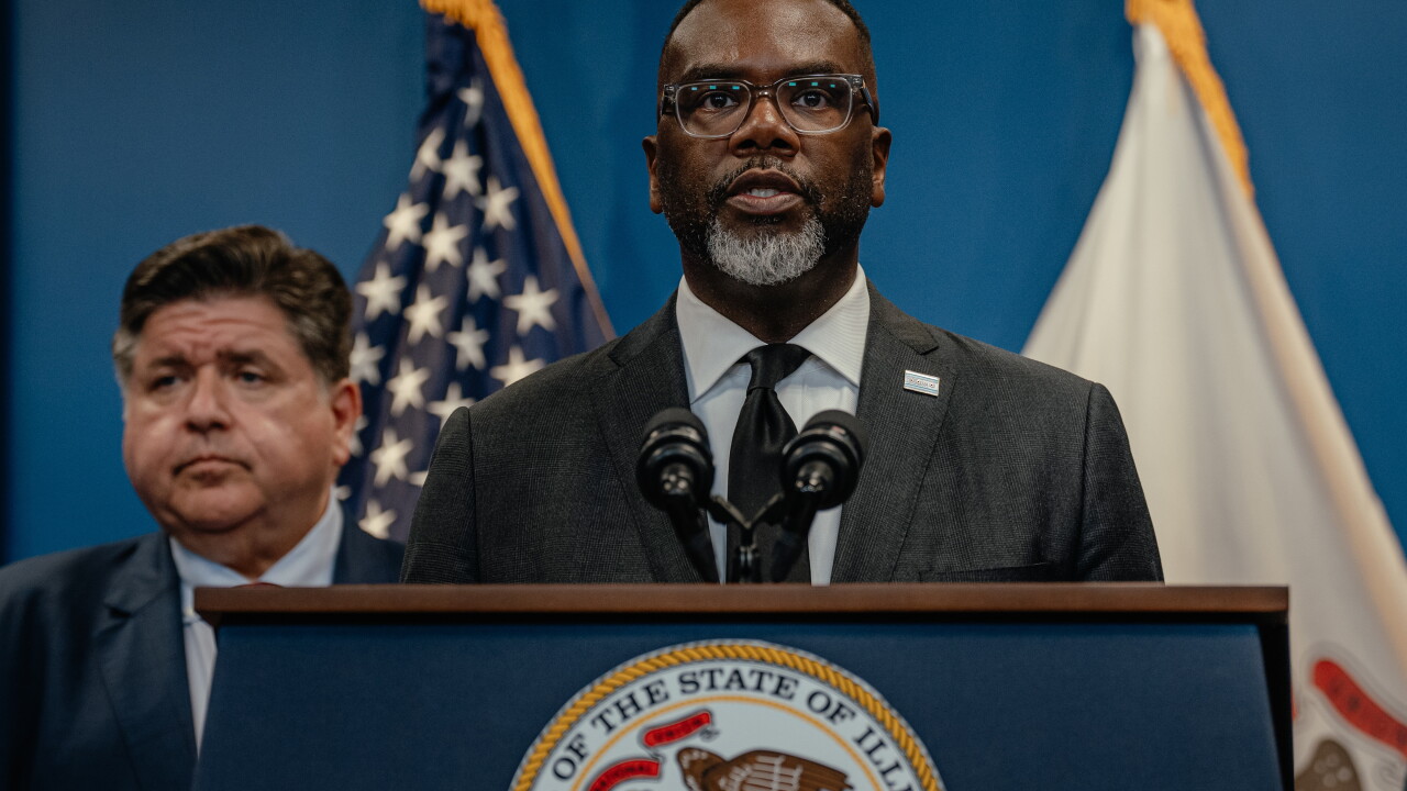 Chicago Mayor Brandon Johnson speaks at lectern