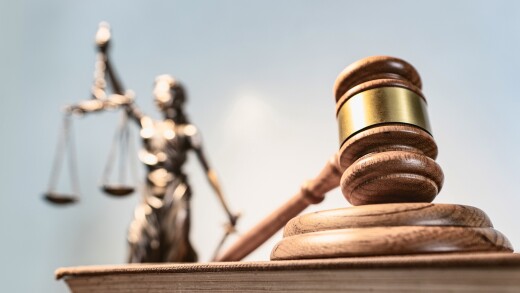 Statue of lady justice on bright background - Side view with cop