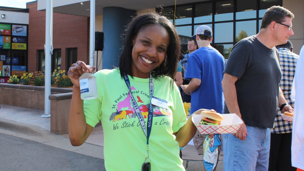 Talia Jones, Mortgage Loan Servicing Coordinator, enjoys St. Paul’s FCU sponsored “National Night Out.” The CU hosts the event in its parking lot and invites the neighborhood to enjoy hot dogs, hamburgers, shaved ice, bounce houses, karaoke, door prizes and a DJ.