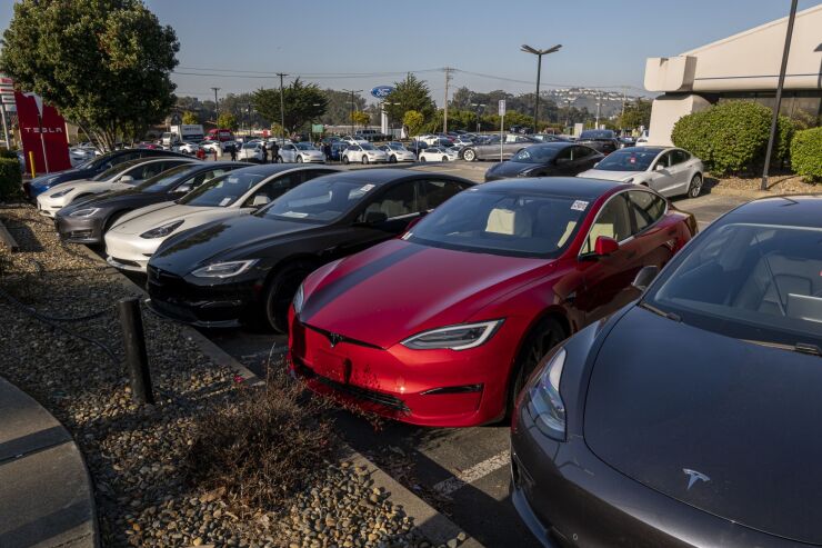 A Tesla dealership in Colma, California, U.S., on Wednesday, Jan. 26, 2022. U.S. auto sales will climb just 3.4% this year to 15.4 million cars and trucks as the semiconductor shortages continue to constrain vehicle inventory, auto dealers predict. Photographer: David Paul Morris/Bloomberg