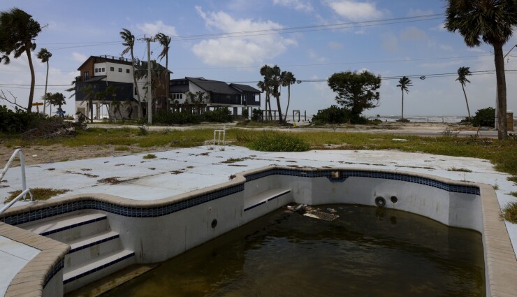 A pool outside a destroyed home in Fort Myers Beach Florida in August, almost a year after Hurricane Ian.