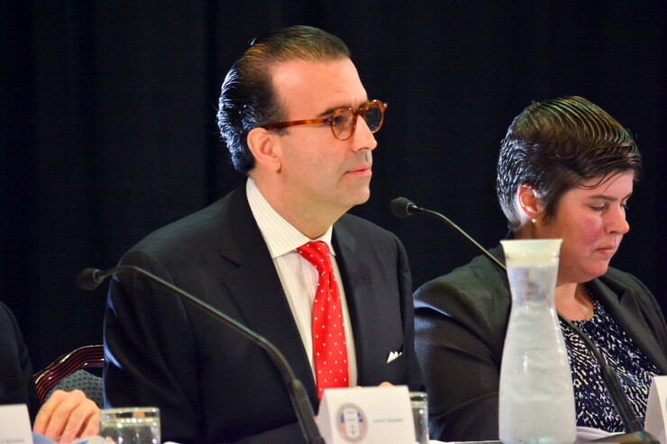 Puerto Rico Oversight Board Chairman Jose Carrion listening.