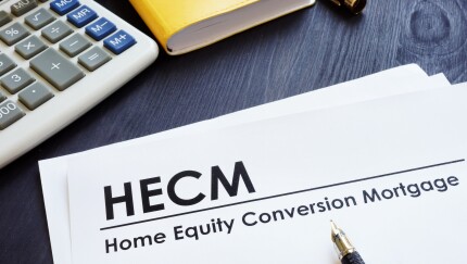 Home Equity Conversion Mortgage HECM on a desk.