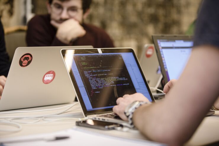 Students work at laptops at Le Wagon coding boot camp in Paris, France, on Monday, Jan. 22, 2018. Boris Paillard, who once developed equity and rates models at HSBC’s Paris office, is now co-founder of Le Wagon, a 9-week $8,000 boot camp that teaches computer code to a growing number of bankers, consultants and marketing types. Photographer: Marlene Awaad/Bloomberg